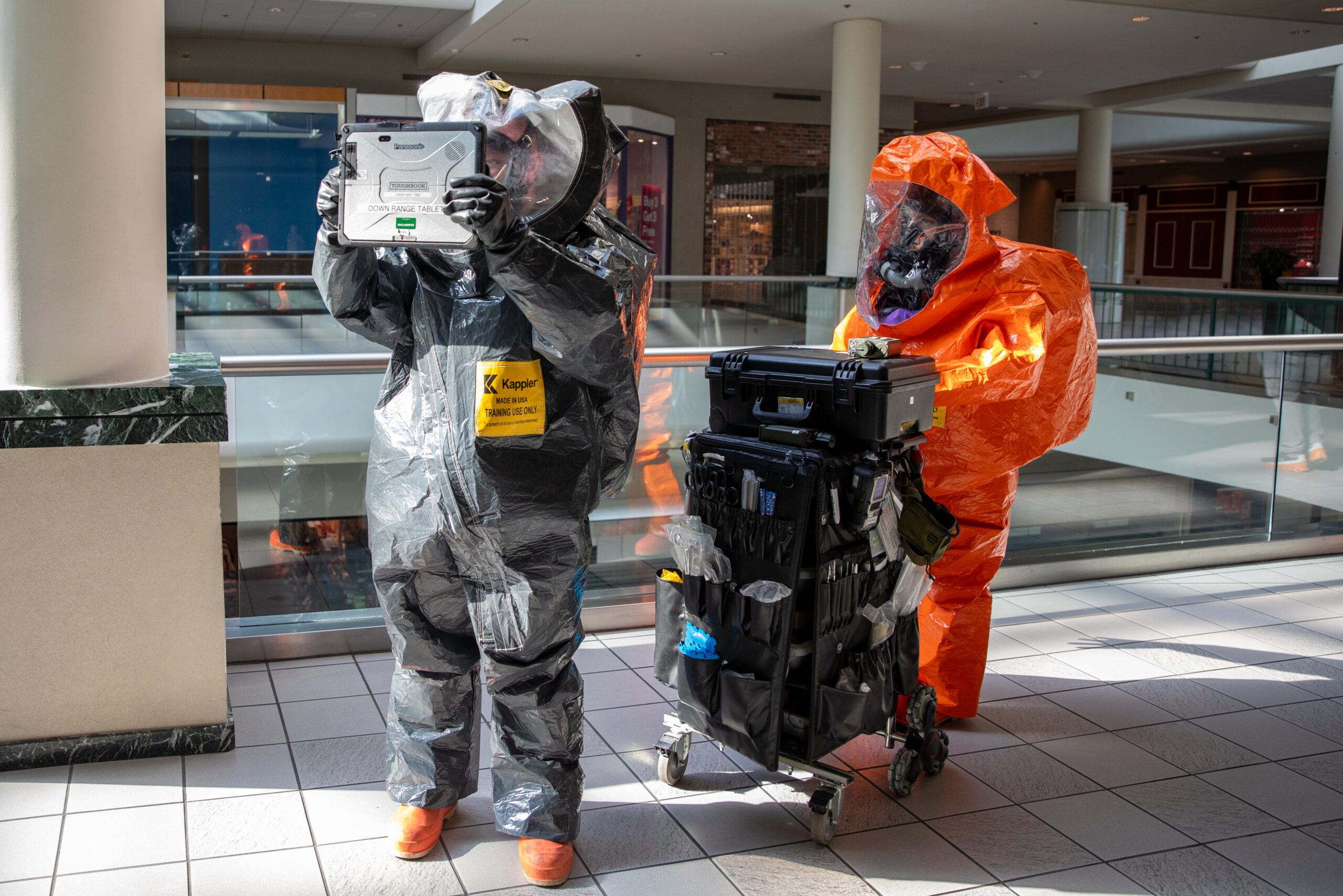 NORTH ATTLEBORO, Mass – Members of the Massachusetts National Guard 1st Weapons of Mass Destruction, Civil Support Team provide real time updates to the incident commander, during an evaluation training event at the Emerald Square Mall, November 7, 2024. The evaluation took place over two days in North Attleboro and tested the CST on their ability to respond to an incident involving a variety of WMDs. The CST's mission is to support civil authorities at a domestic incident site by identifying chemical, biological, radiological, nuclear, or high-yield explosives, agents, and substances, assessing current and projected consequences, and advising response measures. (U.S. Army photo by Sgt. 1st Class Steven Eaton)