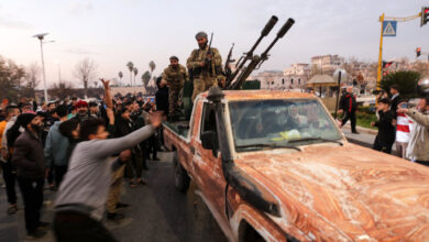 Residents take to the streets of Hama, to welcome anti government fighters after they took control of Syria's west-central city. Photo: AFP