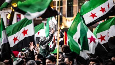 UTRECHT - The fall of the Assad regime in Syria is celebrated during a demonstration near Domplein. As in other countries, people are taking to the streets in joy over the departure of Syrian leader Bashar al Assad. ANP ROB ENGELAAR netherlands out - belgium out (Photo by ROB ENGELAAR / ANP MAG / ANP via AFP)