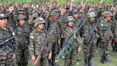 Members of the Bangsamoro Islamic Armed Forces (BIAF), armed wing of the Moro Islamic Liberation Front (MILF), gather inside one of their camps in Mindanao. TED ALJIBE | Credit: AFP [File Photo from Agence France-Presse (AFP)]