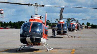 A row of TH-57 Sea Ranger helicopters waits on the runway at Naval Air Station Whiting Field, June 9, 2014. During the advanced flight training phase of a two-year-long flight school course, future Coast Guard pilots train for 7-8 months in the TH-57, learning aircraft systems and avionics, routine and emergency procedures, flight planning, risk management techniques, and earning their instrument rating, which allows them to fly in clouds and restricted visibility.