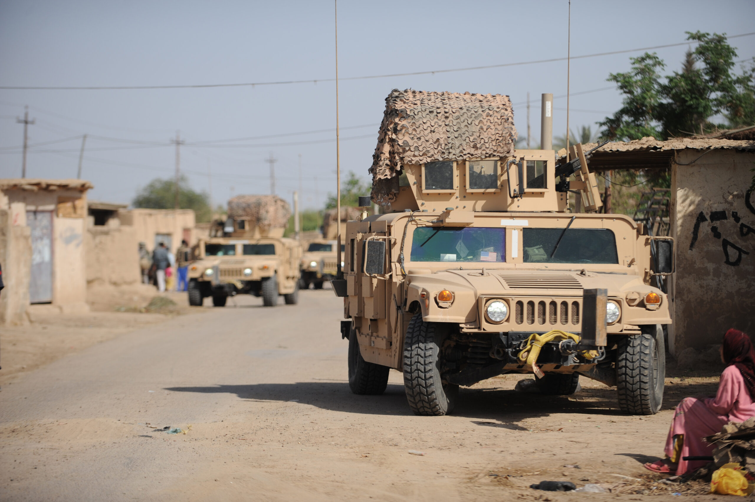 Humvee's from the 532nd Expeditionary Security Forces Squadron, Joint Base Balad, Iraq, conduct security during a patrol in the village of Abo Atei, April 9, in support of Operation Iraqi Freedom.