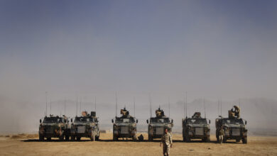 Photographer: Corporal Jamie Osborne Caption: The Bushmaster Infantry Mobility Vehicle at the range in Camp Holland. Title: Range practice in Afghanistan Deep Caption: Soldiers from the Reconstruction Task Force conducted a realistic live fire exercise at Camp Holland, Afghanistan. Soldiers regularly conduct these practices to stay as well trained as they can. Australia has deployed an ADF Reconstruction Task Force (RTF), consisting of a combined arms team, to the Uruzgan Province in southern Afghanistan as part of Operation Slipper. The RTF is in partnership with the Netherlands Provincial Reconstruction Team (PRT) and forms part of the NATO- led International Security Assistance Force. The RTF has a clearly defined role to work on reconstruction, improvement of provincial infrastructure and community based projects. The RTF also provides trade training to the local population and military engineering training to the Afghan National Army. This type of assistance is designed to benefit the people of Uruzgan Province well into the future and form building blocks of a stable and prosperous community. The RTF contains around 370 ADF personnel from predominately Queensland-based units. It includes elements to provide command, security, engineering, and administrative support and is equipped with Bushmaster Infantry Mobility Vehicles (IMV), Australian Light Armoured Vehicles (ASLAVs) and armoured engineer plant equipment. Australia's contribution to ISAF is an important component of the Australian Government's commitment to assist Afghanistan achieve a stable and secure future. *** Local Caption *** Australia has deployed an ADF Reconstruction Task Force (RTF), consisting of a combined arms team, to the Uruzgan Province in Southern Afghanistan as part of Operation Slipper. The RTF is in partnership with the Netherlands Provincial Reconstruction Team (PRT) and forms part of the NATO- led International Security Assistance Force. The RTF has a clearly defined role to work on reconstruction, improvement of provincial infrastructure and community based projects. The RTF also provides trade training to the local population and military engineering training to the Afghan National Army. This type of assistance is designed to benefit the people of Uruzgan Province well into the future and form building blocks of a stable and prosperous community. The RTF contains around 370 ADF personnel from predominately Queensland based units. It includes elements to provide command, security, engineering, and administrative support and is equipped with Bushmaster Infantry Mobility Vehicles (IMV), Australian Light Armoured Vehicles (ASLAVs) and armoured engineer plant equipment. Australia's contribution to ISAF is an important component of the Australian Government's commitment to assist Afghanistan achieve a stable and secure future.