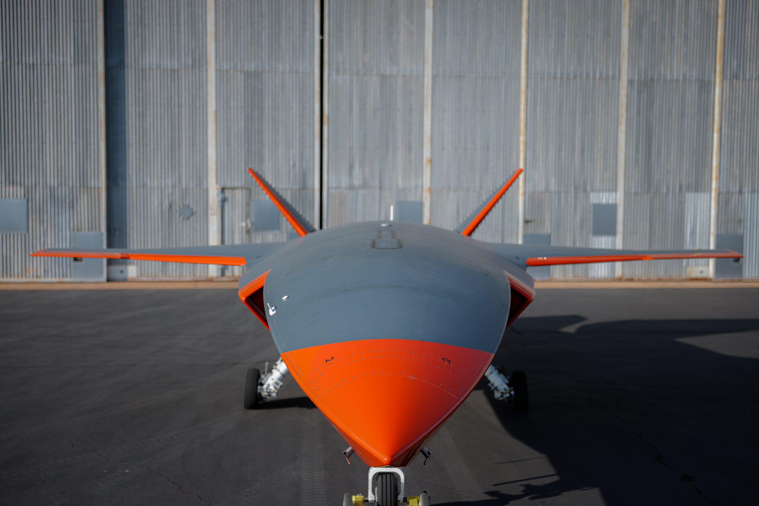 MQ-28A Ghost Bat aircraft in front of a hangar. *** Local Caption *** The first military combat aircraft to be designed, engineered and manufactured in Australia in more than 50 years, the MQ-28A Ghost Bat is an autonomous air vehicle intended to operate as part of an integrated system of crewed and un-crewed aircraft and space-based capabilities.Collaborative combat aircraft (CCA) such as the MQ-28A Ghost Bat are entirely new technology. The aircraft are managed by crewed platforms but have the ability to operate autonomously without continuous control from air or ground-based crews.

While the MQ-28A is developmental, continued investment preserves the platform as a sovereign development opportunity that could provide a pathway for potentially accelerated acquisition of a CCA capability in the future.