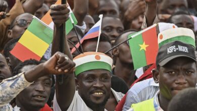 Niger's pro-coup supporters carry the flags of Burkina Faso, Mali and Russia during a protest in Niamey, Niger, Sept. 16, 2023. (AFP Photo)