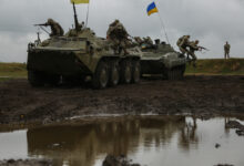 Ukrainian Soldiers of 1st/30th Mechanized Infantry Battalion, role-playing as the opposition force, jump off a BMP-1 and BTR-80 while conducting round robin training during Exercise Rapid Trident 17 at the International Peace Keeping Security Centre in Yavoriv, Ukraine Sept, 12, 2017. Rapid Trident 17 will provide participating nations with the opportunity to improve theatre security cooperation within Eastern Europe, enhance interoperability amongst NATO members and partners, and to combine capabilities to operate joint, multinational and integrated security operations. (U.S. Army photo by Pfc. Zachery Perkins)