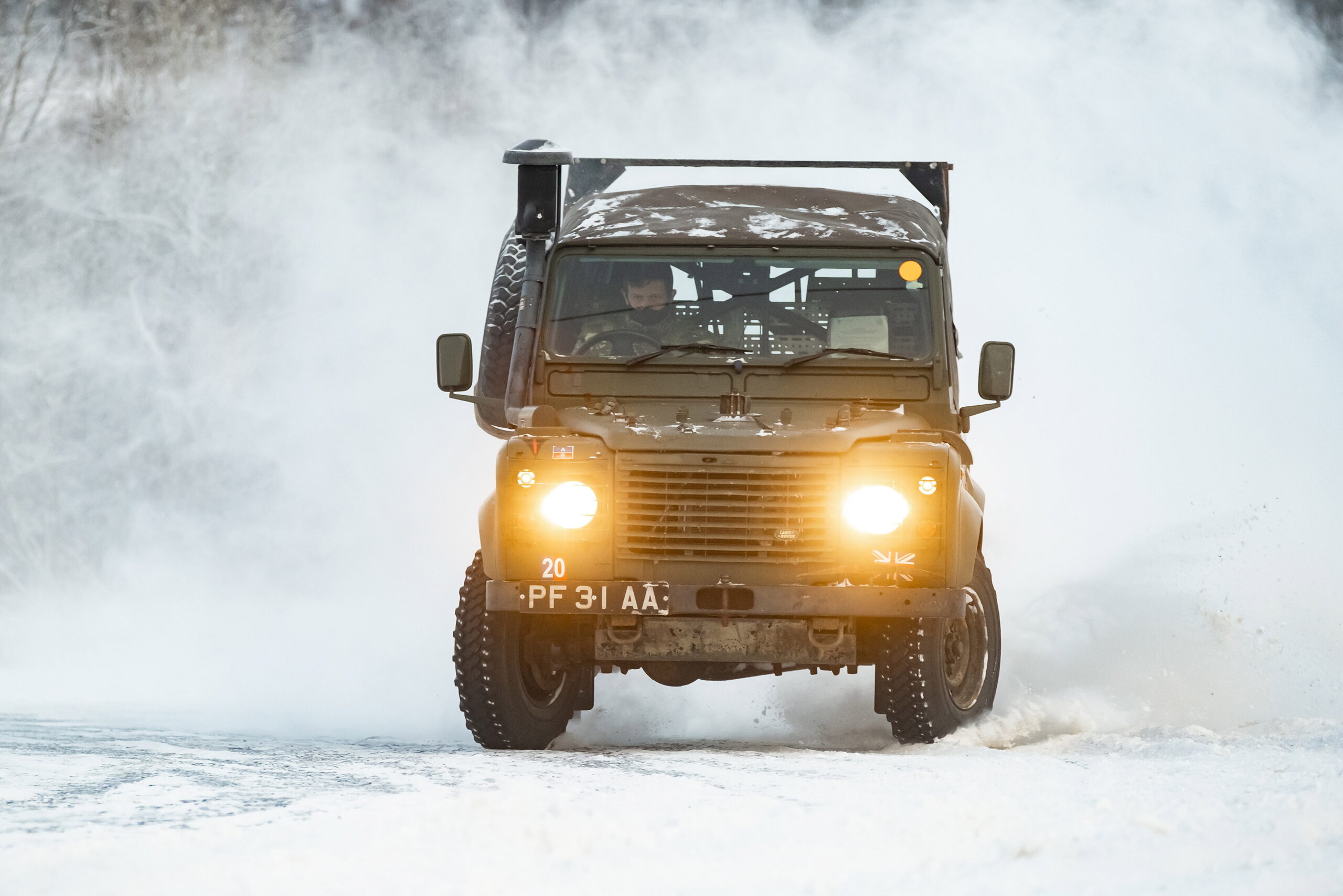 Pictured are Royal Marines conducting snow & ice driver training in a Land Rover Wolf 4x4 vehicle at the NAF (Norges Automobil-Forbund) circuit at Ovingsbane Bardu, Norway. 45 Commando (45 Cdo) are the UKs Cold Weather Warfare Specialists and have returned to the arctic to hone their warfighting skills in one of the most inhospitable environments. As the Lead Command Unit, 45 Cdo must be prepared to conduct Operations anywhere in the world. The Commandos were in the High North learning to be winter warriors conducting Arctic survival training in bitterly cold temperatures. The conditions are harsh around 200 miles inside the Arctic Circle, where the sun barely rises and temperatures plummet to below -30C. The Land Rover Wolf 4×4 is used as a light utility vehicle and has been adopted in a number of guises and body styles including fire engines, excavators, communication vehicle, ambulance, a lightweight model for air transport, snowplough, and six-wheel drive, amphibious and track-propelled versions.