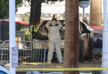 An investigator photographs a Tesla Cybertruck that exploded outside the lobby of the Trump hotel in Las Vegas. Photo: WADE VANDERVORT/AFP