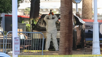 An investigator photographs a Tesla Cybertruck that exploded outside the lobby of the Trump hotel in Las Vegas. Photo: WADE VANDERVORT/AFP