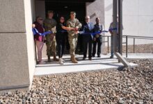 Col. Jeremy Raley, director of the Air Force Research Laboratory’s Space Vehicles Directorate, cuts a ceremonial ribbon in front of the new Radiation Tolerance Research on Electronics for Space and Strategic Systems, or FORTRESS, facility doors Aug. 20, 2024, at Kirtland Air Force Base, N.M. The ceremony commemorated the opening of the new building. FORTRESS will be used for developing new electronic components in space. (U.S. Air Force photo / Paul Robinson)