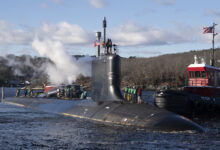 The pre-commissioning unit (PCU) Iowa (SSN 797) arrives for the first time at Naval Submarine Base New London in Groton, Connecticut, December 19, 2024. The future USS Iowa was delivered to Submarine Squadron (SUBRON) 4 from General Dynamics Electric Boat shipbuilding facility down river after recently completing a series of at-sea testing. The fast-attack submarine PCU Iowa and crew operate under SUBRON 4 and its primary mission is to provide fast-attack submarines that are ready, prepared, and committed to meet the unique challenges of undersea combat and deployed operations in unforgiving environments across the globe. (U.S. Navy photo by John Narewski)