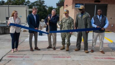 The official party ceremonially open the new Naval Surface Warfare Center Panama City Division Acoustic Test Facility and Instrumentation building onboard Naval Support Activity Panama City, Feb. 5. (from left) Amanda Davis, NSWC PCD (acting) Accounting Division head, Dr. Peter Adair, NSWC PCD technical director, Dr. Joseph Lopes, NSWC PCD Subsea and Seabed Warfare and Maritime Operations Department deputy, Capt. Paul Stence Jr., NSWC PCD commanding officer, Cmdr. Michael Mosi, NSA PC commanding officer, and Dr. Jermaine Kennedy, NSWC PCD Littorals and Undersea Surveillance Division head. (U.S. Navy photo by Eddie Green)