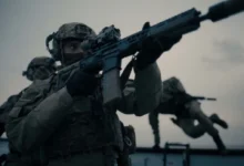 A British soldier holding a rifle