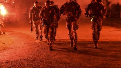 Haitian comandos step off from the starting point of a 20-kilometer ruck march during Fuerzas Comando, July 17, 2018 at the Instituto Superior Policial, Panama. Fuerzas Comando is an annual multinational special operational forces skills competition sponsored by U.S. Southern Command and hosted this year by the Ministry of Public Security, Panama. Through friendly competition, this exercise promotes interoperability, military-to-military relationships, increases training knowledge, and improves regional security. (U.S. Army Photo by Staff Sgt. Brian Ragin/Released)