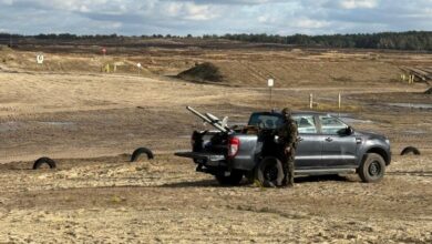 The Merops counter-drone system placed on a black truck bed with a soldier operating it.