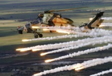 Air to Air of Tiger ARH A38-001 performing a jettison of it's Counter Measure Dispensing System. At the Port Wakefield proving ground. Trial E3032 Tiger ARH CMDS