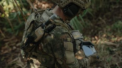 A soldier equipped with a handheld radio. Photo: L3Harris