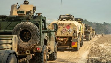 Tactical vehicles, operated by US Soldiers assigned to the 3rd Infantry Division, travel drive in formation while conducting convoy operations during Spartan Focus