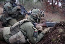 Lithuanian troops defend their position versus opposing forces during a combat exercise.