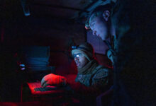Soldiers assigned to 2nd Battalion, 77th Field Artillery Regiment, 4th Infantry Division Artillery, 4th Infantry Division, analyze data on a computer during a deployment readiness exercise, April 29, 2026, at Fort Carson, Colorado. Digital systems enable faster decision-making and improve coordination across fire support elements. (U.S. Army photo by Spc. Jonathan Reyes)
