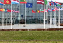 NATO headquarters in Brussels, Belgium, displays the flags of the alliance's 32 member states. Photo: Michael Nguyen/NurPhoto via AFP