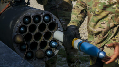 A U.S. Army Soldier assigned to the 12th Combat Aviation Brigade load an Advanced Precision Kill Weapon System (APKWS) training round for a live-fire exercise, Sept. 23, 2021, Grafenwoehr Training Area, Germany. The APKWS is the newest laser-guided rocket system utilized by the 12th CAB stationed throughout Europe. (U.S. Army photo by Pfc. Jesus Menchaca)