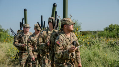 U.S. Army Troopers (right to left) Spc. Michael Hierro, Pfc. Ryan Ladd, Spc. Jonathan Shedd, and Spc. Andrew Lowenberg, assigned to the 8th Brigade Engineer Battalion, 2nd Armored Brigade Combat Team, 1st Cavalry Division, conducts a training exercise to evaluate the Terrestrial Layer System (TLS) Manpack at Fort Hood, Texas, August 14, 2025. The Troopers maneuvered through a condensed field environment to operate the TLS-Manpack, locating strategically placed targets using its signal intelligence and electronic warfare capabilities.