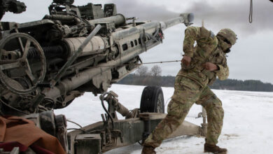 U.S. Army Pfc. Nick Seepersad, assigned to the 4th Battalion, 319th Airborne Field Artillery Regiment, 173rd Airborne Brigade, fires an M777 Alpha 2 Medium Towed Howitzer during Table XV qualification at 7th Army Training Command's Grafenwoehr Training Area, Feb. 5, 2026. Table XV integrations test fires within a tactical scenario to validate crews’ ability to execute fire missions safely and accurately. (U.S. Army photo by Spc. Nathan Morse)