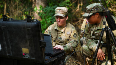 Soldiers using a rugged computer in the field