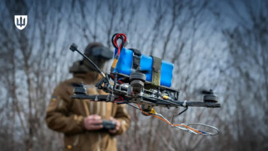 Ukrainian FPV drone operator holding a quadcopter during combat preparation. Photo: Ministry of Defence of Ukraine