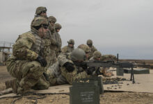 Giving guidance on correcting his aim, Staff Sgt. Tyler Hunter shouts directions to Spc. Timothy Martin as he fires the M240 machine gun. Sgt. Randy Torrecer provides support for Martin. The last week of training begins on a cold rain swept day trip to the Orchard Combat Training Center. The scout trainees will take turns driving a Bradley Fighting Vehicle. On the range the trainees will fire the Mark 19 machine grenade launcher, the 50 Cal. Machine gun and the 240B machine gun. During the remainder of the week, they learn how to boresight the 25mm gun; the fundamentals of reconnaissance and security; how to establish an observation post; and how to handle and detonate explosives. U.S. Army Cavalry Scouts act as the eyes and ears on the field, gathering information about enemy positions, vehicles, weapons, and activity. The scouts often operate in small groups gathering intelligence. With the information they gather, commanders can make informed decisions about how to move troops and where and when to attack. Their scouting duties include conducting mounted and dismounted navigation, collecting data about tunnels and bridges, and serving as members of observation and listening posts. In addition to basic soldiering skills, cavalry scouts learn to secure and prepare ammunition on scout vehicles, load, clear and fire individual and crew-served weapons.