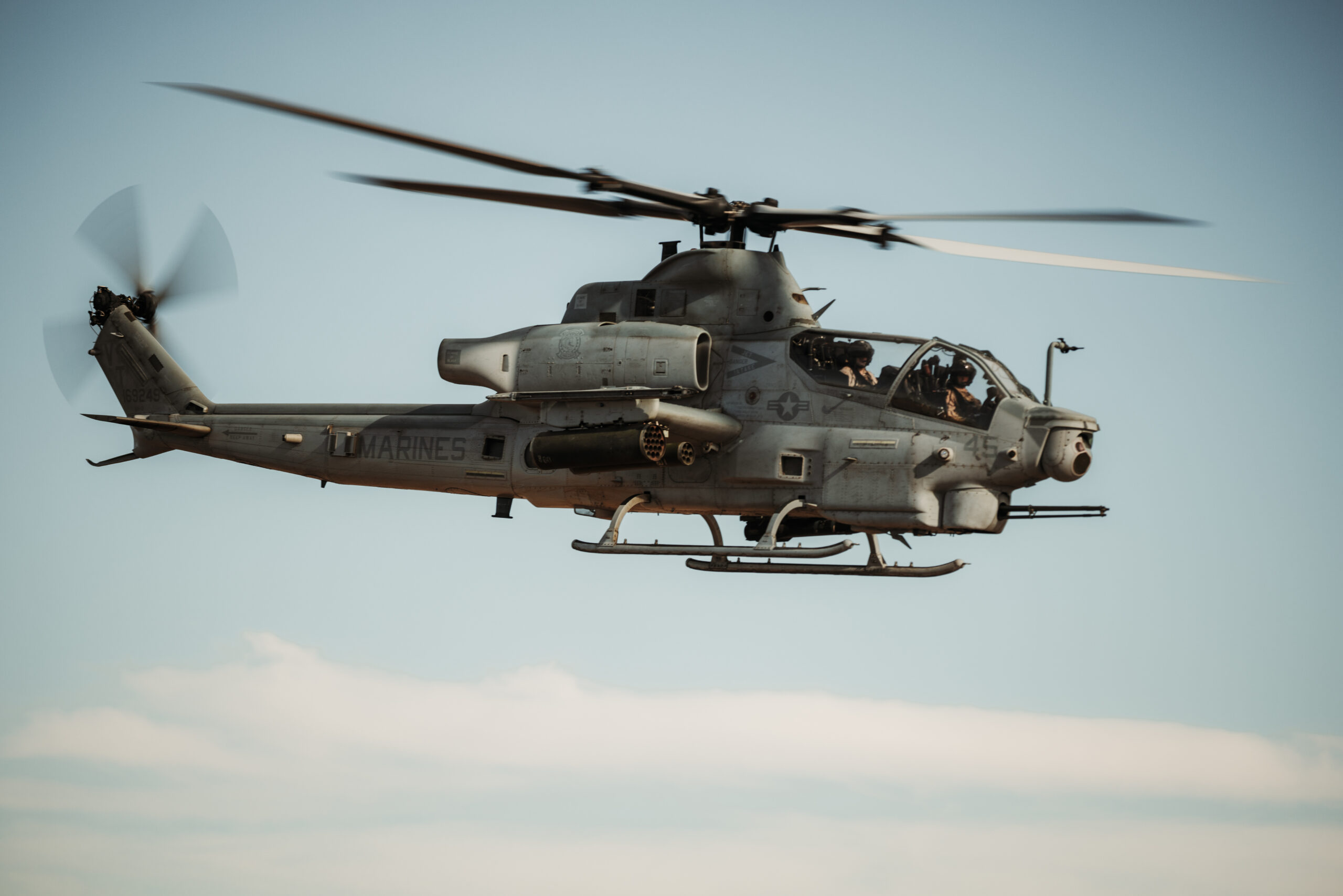 A U.S. Marine Corps AH-1Z Viper assigned to Marine Light Attack Helicopter Squadron (HMLA) 367, Marine Aircraft Group 39, 3rd Marine Aircraft Wing, flies during close air support drills as part of Service Level Training Exercise 4-25 at Marine Corps Air Ground Combat Center, Twentynine Palms, California, July 26, 2025. MCAGCC serves as the Marine Corps’ premier training venue for service-level exercises by providing realistic multi-domain environments to prepare forces for success in future conflicts. (U.S. Marine Corps photo by Lance Cpl. Micah Thompson)