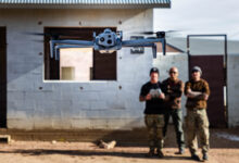 A Green Beret assigned to 4th Battalion, 10th Special Forces Group (Airborne) demonstrates the operation of an unmanned aerial system during a drone course at Fort Carson, Colorado, Dec. 2, 2025. The training enhances operators’ understanding of drone capabilities and mission integration, improving the unit’s ability to employ unmanned systems in complex operational environments. (U.S. Army photo by Sgt. Zachary Myers)