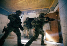 Green Berets assigned to 1st Special Forces Group (Airborne) enter a room during close-quarters battle training at Joint Base Lewis-McChord, Washington, Sept. 16, 2026. The exercise replicated realistic operational conditions, allowing Soldiers to refine close-quarters tactics, communication, and team coordination in preparation for real-world missions. 1st SFG(A) maintains highly lethal, rapidly deployable forces to execute the full spectrum of special operations alongside allies, partners, and the joint force as the preferred partner and premier special operations entity in the U.S. Pacific Command area of responsibility. (U.S. Army photo by Staff Sgt. John Bae) This photo was altered for security purposes in accordance with USSOCOM Manual 360-1.