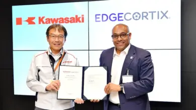 Hideaki Nishimoto, General Manager of the Defense & Aerospace Business Division at Kawasaki Heavy Industries, and Dr. Sakya Dasgupta, Founder and CEO of EdgeCortix, display the agreement between the companies. Photo: EdgeCortix