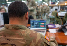 A US Army 11th Airborne Division soldier uses a computer during an exercise. Photo: Correy Mathews/US Army 11th Airborne Division