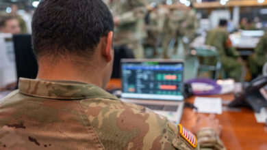 A US Army 11th Airborne Division soldier uses a computer during an exercise. Photo: Correy Mathews/US Army 11th Airborne Division