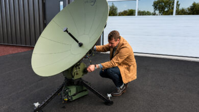 Program Manager Rich Steixner with the Lite Coms LITE SAT 1.3A terminal supporting the ADF LAND 4140 LAND C4 Modernization program.