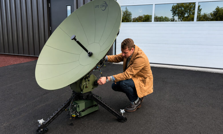 Program Manager Rich Steixner with the Lite Coms LITE SAT 1.3A terminal supporting the ADF LAND 4140 LAND C4 Modernization program.