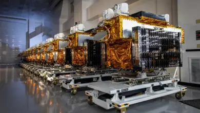 Row of T1TL satellites in a warehouse.