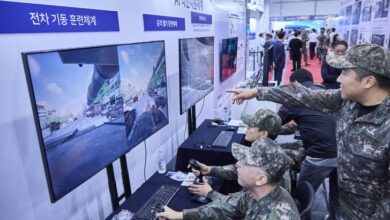 South Korean soldiers interact with battlefield simulation technology showcased by SK Telecom. Photo: SK Telecom