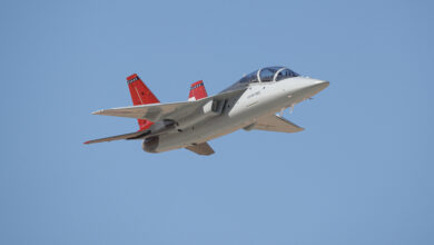 The first T-7A Red Hawk, piloted by USAF test pilot Maj. Jonathan “Gremlin” Aronoff and Boeing test pilot Steve “Bull” Schmidt, soars over Edwards Air Force Base, California, Nov. 8, prior to arrival. The T-7A will replace the 1960s-era T-38 aircraft by providing advanced pilot training capabilities for aviators learning to fly both tactical and bomber aircraft.