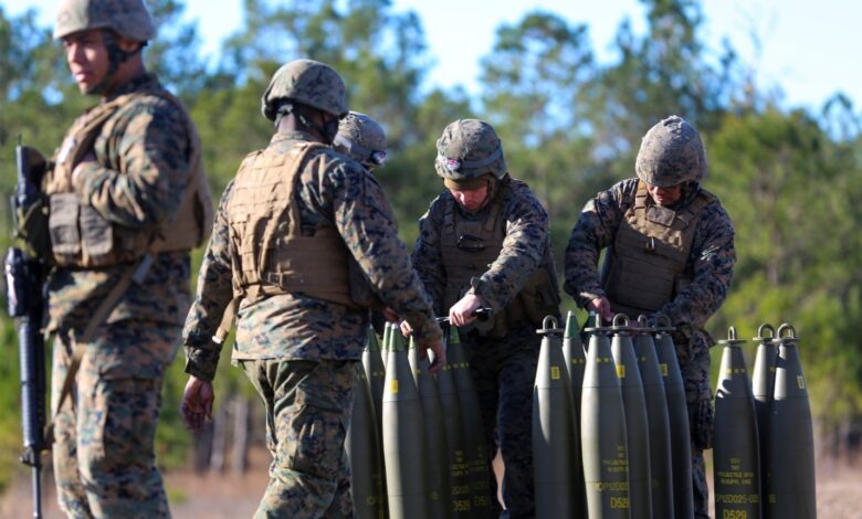 Marines prepare ammunition for a 155 mm Howitzer during a Helicopter Support Team exercise at Camp Lejeune, N.C., Feb. 15, 2017. During the exercise, the Marines prepared and lifted a 155mm Howitzer to a landing zone. Marines from 3rd Battalion, 14th Marine Regiment, 4th Marine Division participated in the training. (U.S. Marine Corps photo by Lance Cpl. Jon Sosner)