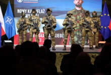 Polish soldiers show off their new uniforms during a presentation.