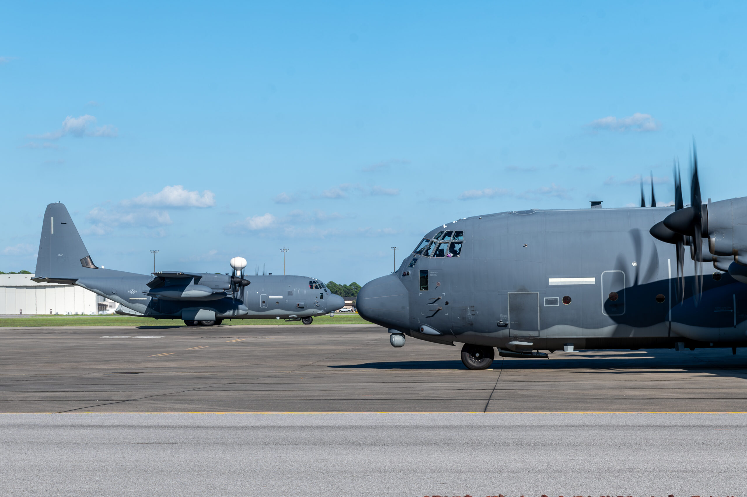Two MC-130J Commando II aircraft taxi on the flightline at Hurlburt Field, Florida, Sept. 27, 2024. Both planes returned safely after evacuating ahead of Hurricane Helene to prevent damage and ensure they maintained mission-ready status. (U.S. Air Force photo by Airman 1st Class Raul Mercado)