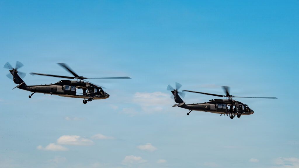 Two Kentucky Army National Guard UH-60 Black Hawk helicopters take off at the Kentucky Air National Guard Base in Louisville, Ky., April 17, 2026 in advance of this weekend’s Thunder Over Louisville air show. The Kentucky Air Guard’s 123rd Airlift Wing is serving as the base of operations for military aircraft participating in the show. (U.S. Air National Guard photo by Senior Master Sgt. Phil Speck)