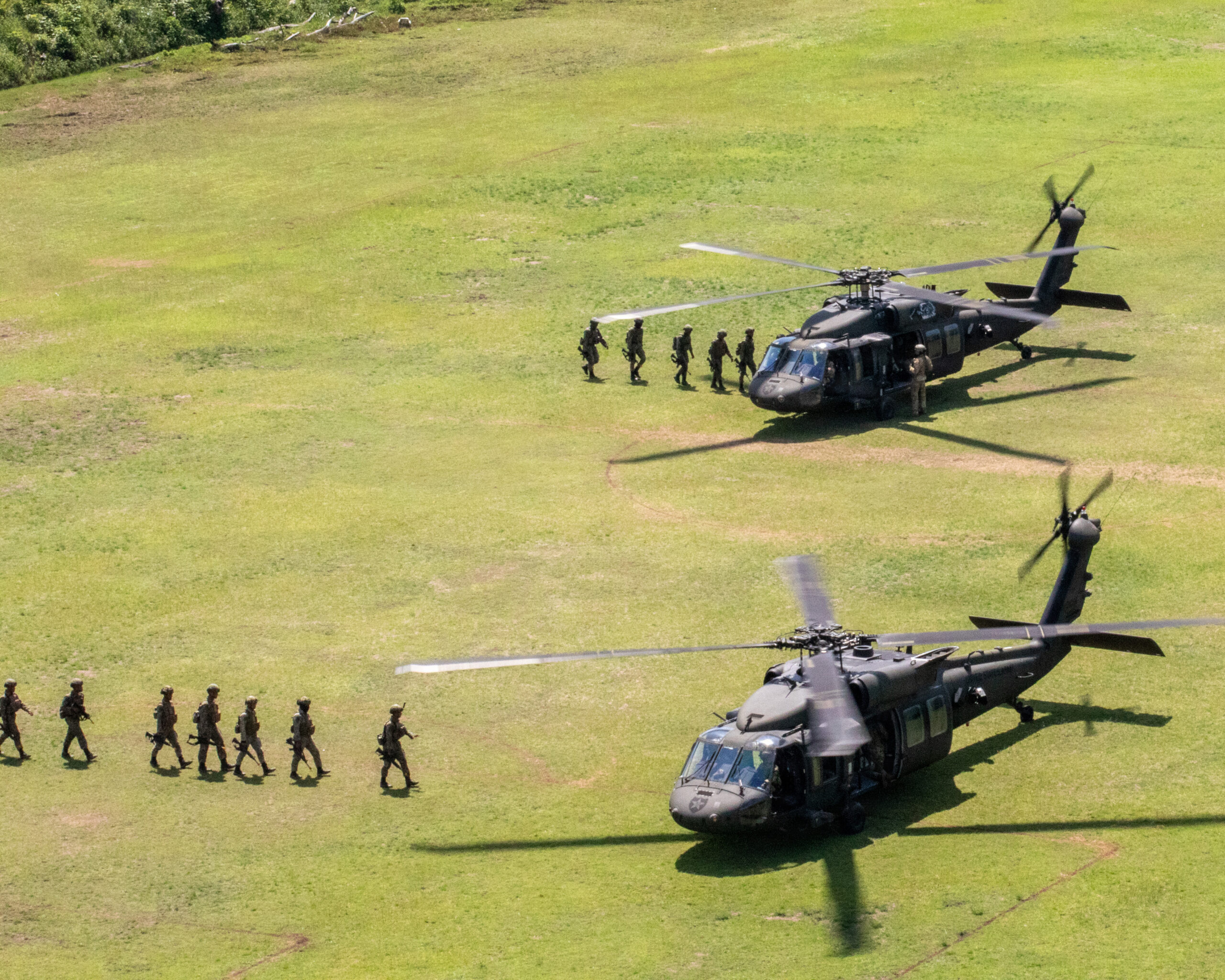 Soldiers from the 26th Royal Malaysian Regiment, 5th Infantry Division board Black Hawk helicopters from the U.S. Army Task Force Nightcard, 2nd Combat Aviation Brigade, 2nd Infantry Division. These Malaysian conducted joint air assault training with Australian Army 162 Recce Squadron, 1st Aviation Regiment, during exercise Keris Strike 2026, in Kota Belud, Malaysia, July 24, 2026. Keris Strike is a long-standing and evolving military exercise designed to enhance interoperability and strengthen security partnerships among American, Australian and Malaysian military forces across the Indo-Pacific region. (U.S. Army photo by Spc. Wesley Richardson)