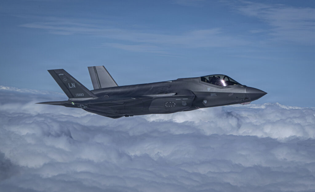 A U.S. Air Force F-35 Lightning II assigned to the 48th Fighter Wing flies in a pattern before a ceremonial flyover at RAF Mildenhall, England, Sept. 11, 2026. The 100th Air Refueling Wing and 48th FW participated in a 9/11 remembrance ceremony, performing a formation flyover during the U.S. national anthem. (U.S. Air Force photo by Senior Airman Cody J. A. Mott)