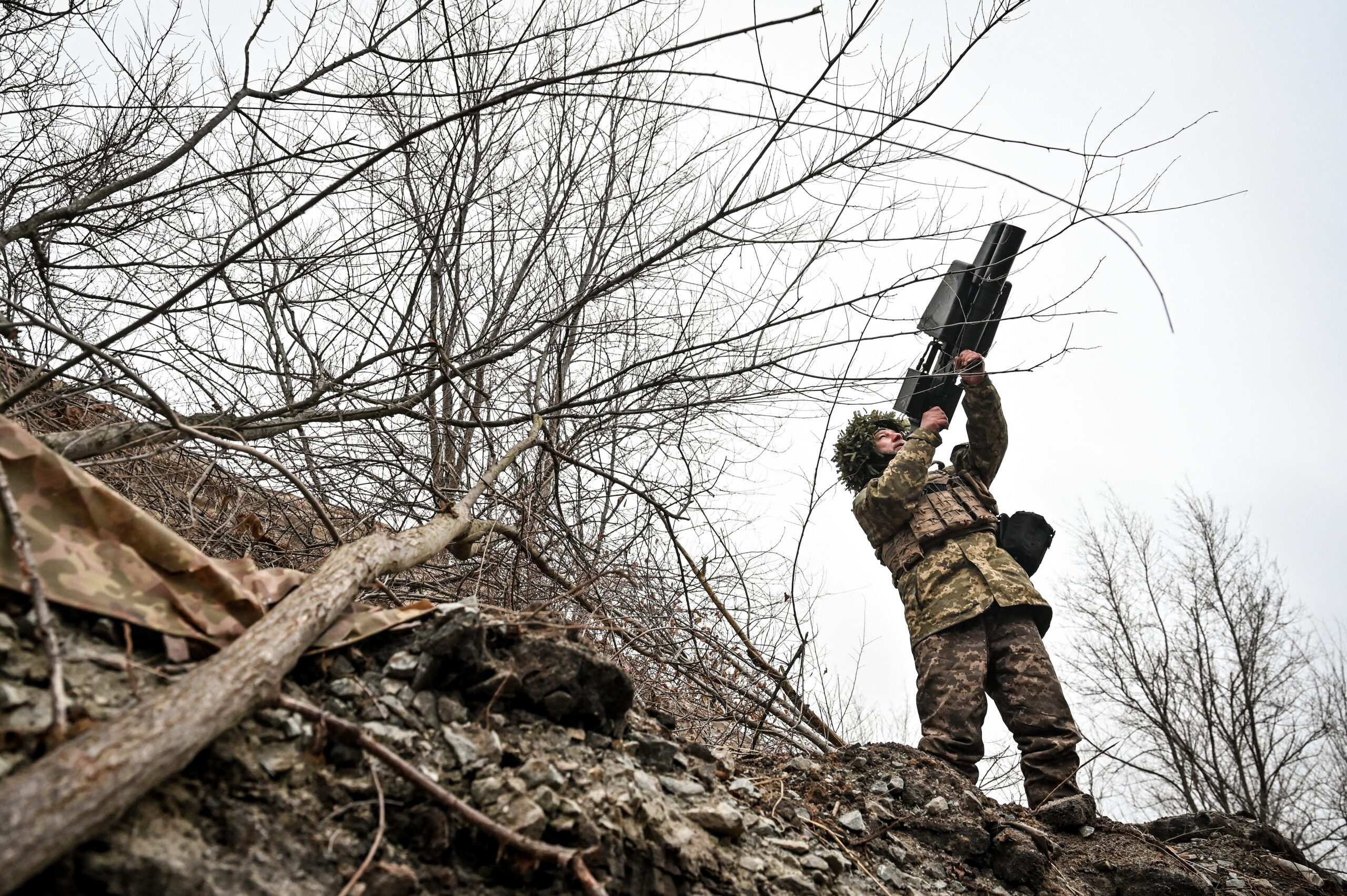 A Ukrainian soldier uses an anti-drone rifle in the Zaporizhzhia direction.