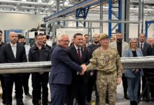 Defense officials attend the opening of Rheinmetall's new arms facility.